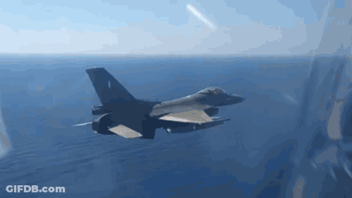 Fighter Jet Flying Over Ocean Under Blue Sky GIF