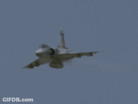 Fighter Jet Flying Through Blue Sky GIF