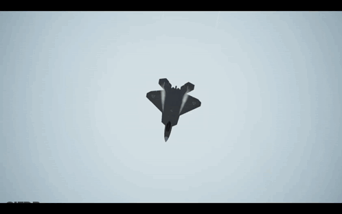 A Fighter Jet Is Flying Through A Cloudy Blue Sky GIF