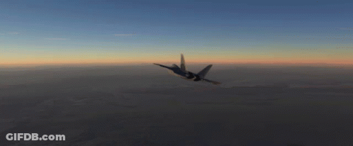 A Fighter Jet Is Flying Through The Air At Sunset GIF
