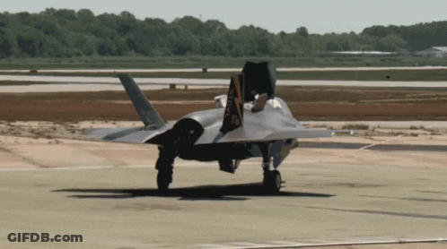A Fighter Jet Is Taking Off From A Runway With The Letters Aa Visible On The Tail GIF