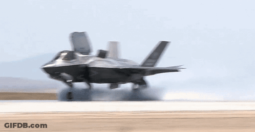 A Fighter Jet Is Taking Off From A Runway With The Letters Gp-34 On The Tail GIF