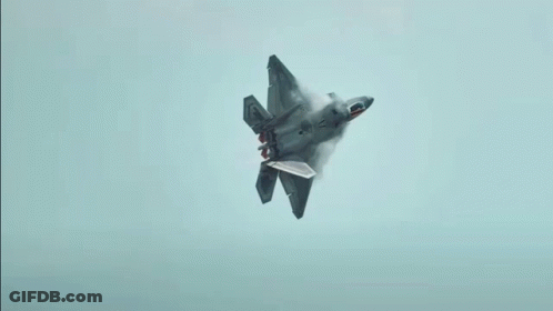A Fighter Jet With The Letter F On The Tail Is Flying Through A Cloudy Blue Sky GIF