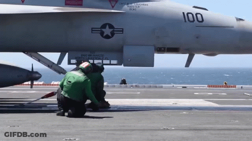 A Fighter Jet With The Number 100 On It GIF