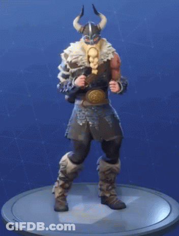 A Figurine Of A Viking With Horns Is Standing On A Round Base . GIF