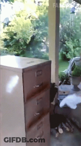 A Filing Cabinet Has The Number 3 On The Drawer GIF