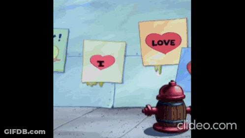 A Fire Hydrant Is Standing In Front Of A Wall With Signs That Say Love And I Love You GIF