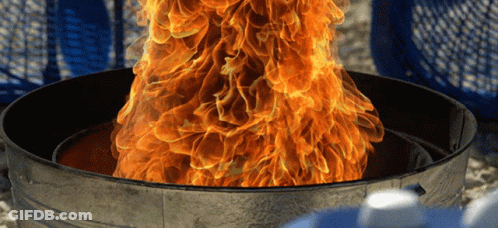 A Fire Is Coming Out Of A Garbage Can GIF