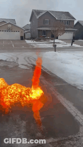 A Fire Is Coming Out Of A Hole In The Ground GIF
