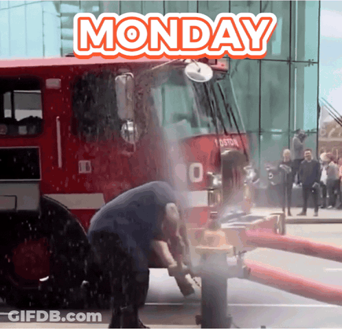 A Fire Truck Is Spraying Water On A Man 'S Head And The Words Monday Are Above It GIF