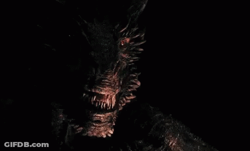 A Fireball Is Coming Out Of A Monster 'S Mouth In The Dark . GIF