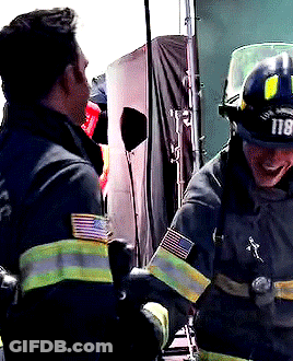 A Firefighter Wearing A Helmet That Says 118 On It GIF