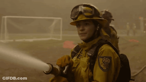 A Firefighter With A Cal Fire Badge On Her Chest GIF