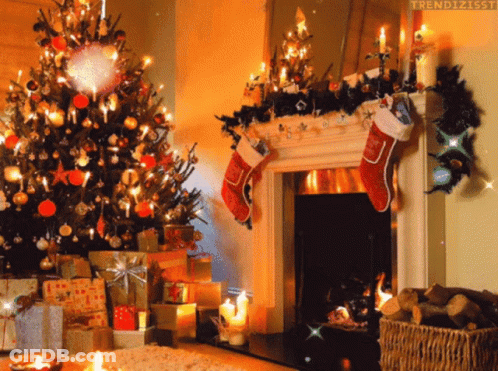 A Fireplace With Christmas Stockings Hanging From It GIF
