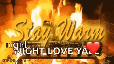 A Fireplace With The Words `` Stay Warm Night Night Love Ya '' Written In Front Of It . GIF