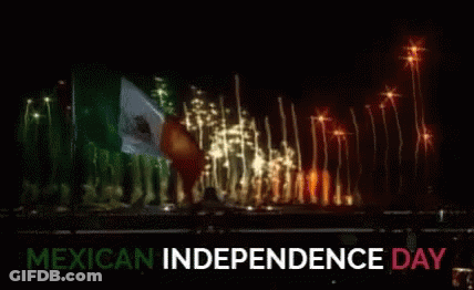 A Fireworks Display For Mexican Independence Day With A Flag In The Background GIF