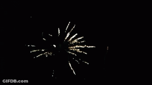 A Fireworks Display In The Night Sky With The Sun Visible In The Background GIF