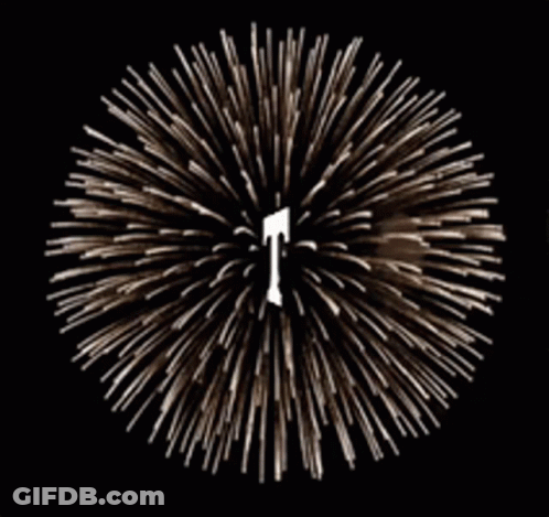 A Fireworks Display With A Letter T In The Center GIF