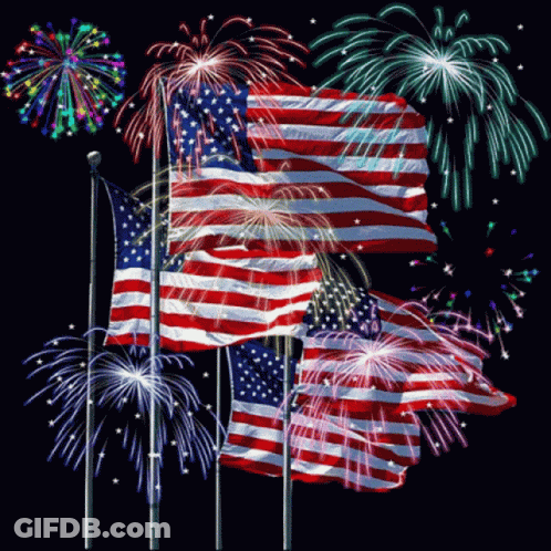 A Fireworks Display With American Flags In The Background GIF