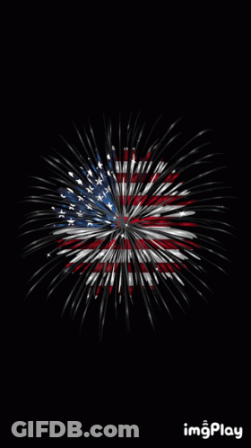 A Fireworks Display With The American Flag In The Middle GIF