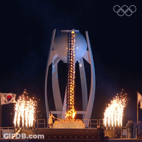 A Fireworks Display With The Olympic Rings On The Bottom Right GIF