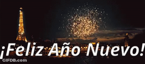 A Fireworks Display With The Words Feliz Ano Nuevo In White Letters GIF