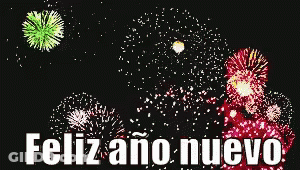 A Fireworks Display With The Words Feliz Ano Nuevo In White Letters GIF