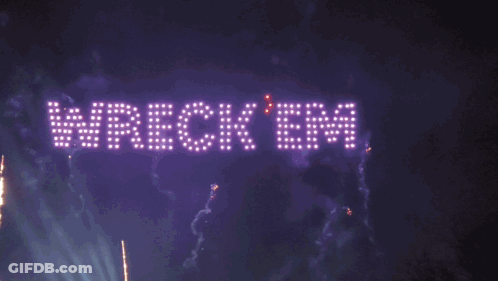 A Fireworks Display With The Words Wreck Em Fc Written In Lights GIF