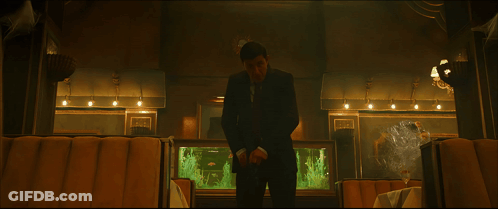 A Fish Tank In A Restaurant With A Sign On The Wall That Says ' Fish ' On It GIF