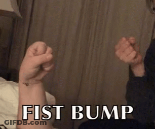 A Fist Bump Is Being Displayed On A Person 'S Arm GIF