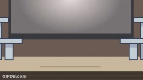 A Flat Screen Tv Is Sitting On A Wooden Table In A Room GIF