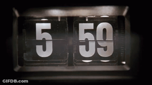 A Flip Clock With The Number 5 And 59 On It GIF