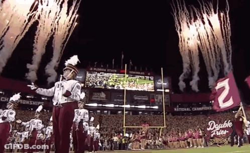 A Florida State Marching Band Performs On The Field GIF