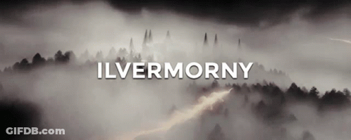 A Foggy Forest With The Word Ilvermorny Written In White GIF