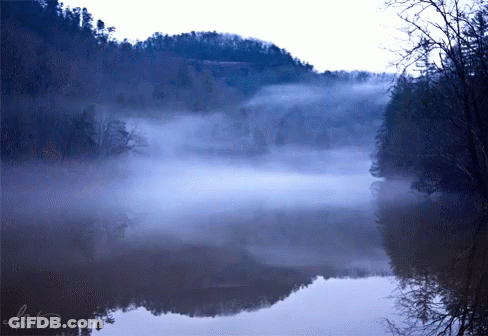 A Foggy Lake With A Mountain In The Background And The Name Watson On The Bottom GIF