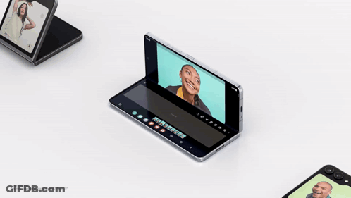 A Folding Phone With A Picture Of A Woman On It GIF