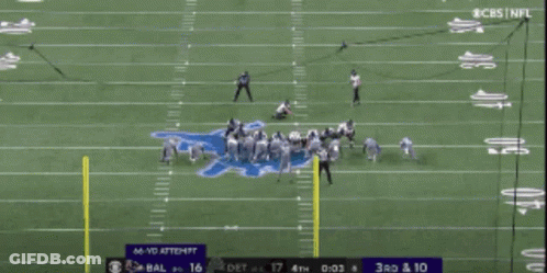 A Football Field With Cbs Sports Written On The Bottom GIF