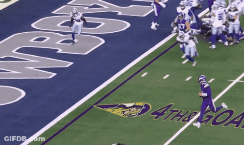 A Football Field With The Word Cowboy On The Side GIF