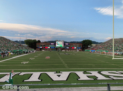 A Football Field With The Word Jets On The Grass GIF