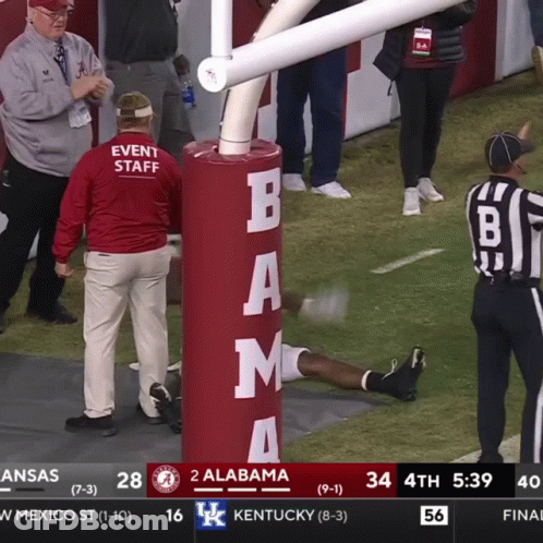A Football Game Between Alabama And Kentucky Is Being Shown On A Television Screen GIF