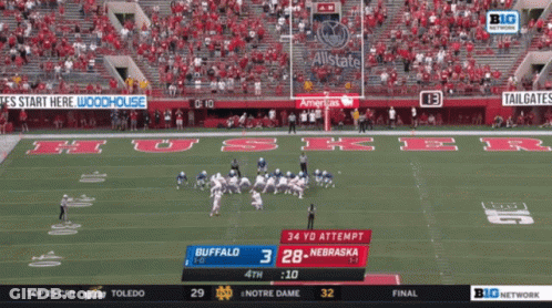 A Football Game Between Buffalo And Nebraska Is Being Shown On Big Network GIF