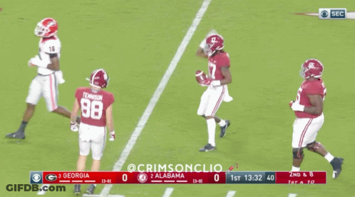 A Football Game Between Georgia And Alabama Is Being Played GIF