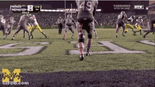 A Football Game Between Michigan And Northwest GIF