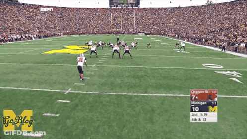 A Football Game Between Michigan And Oregon St. GIF