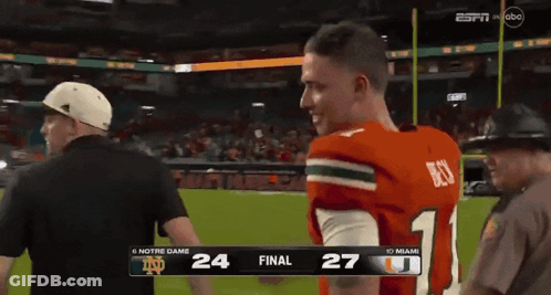 A Football Game Between Notre Dame And Miami Is On Espn GIF