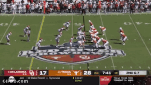 A Football Game Between Oklahoma And Texas Is Being Played GIF