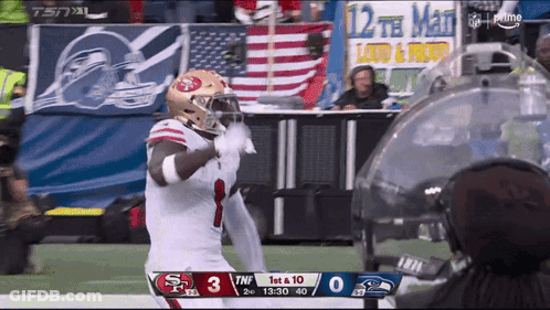 A Football Game Between The 49Ers And Seahawks GIF