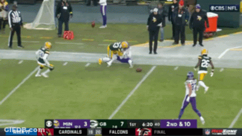A Football Game Between The Cardinals And The Vikings GIF