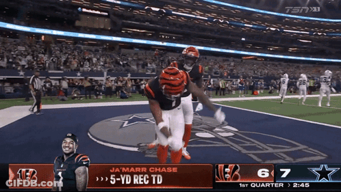 A Football Game Between The Cincinnati Bengals And The Cowboys GIF
