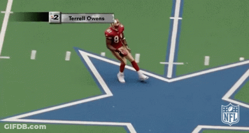 A Football Game Between The Cowboys And The Cardinals With Terrell Owens On The Field GIF